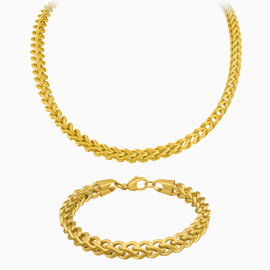 Guldpläterat Franco chain-set med halskedja och armband mot vit bakgrund.#en:color_gold,sv:farg_guld