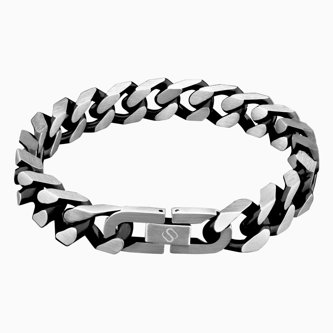 Robust cuban link-armband i svart och silver, frilagd mot vit bakgrund.#en:color_black,sv:farg_svart